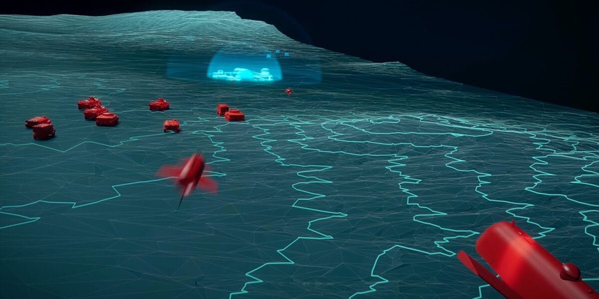 A digital terrain map showing friendly forces tanks and assets in blue, then enemy forces and assets in red.