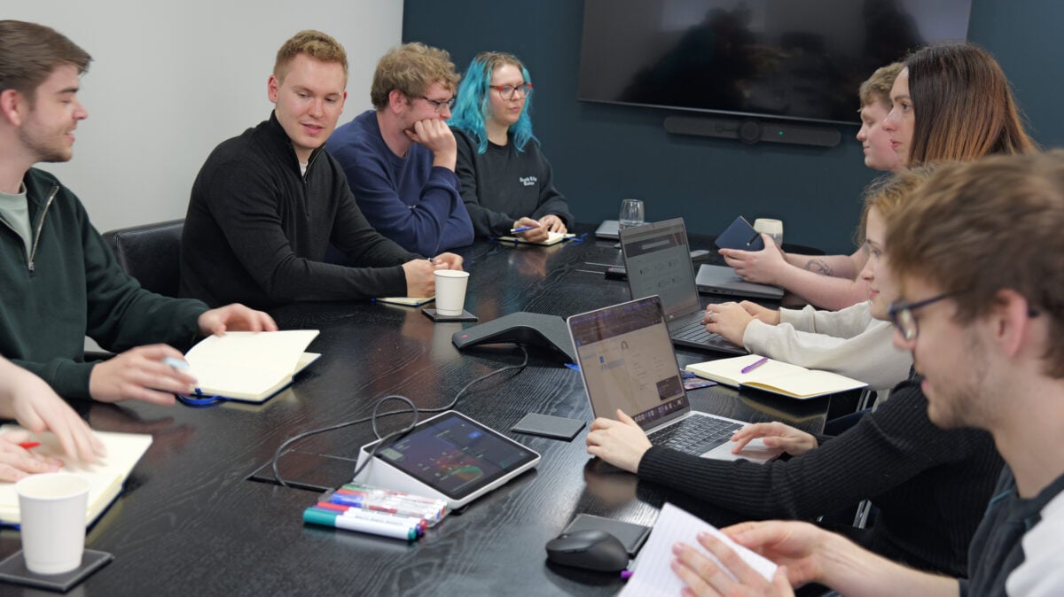 A group of employees having a group discussion in a meeting room